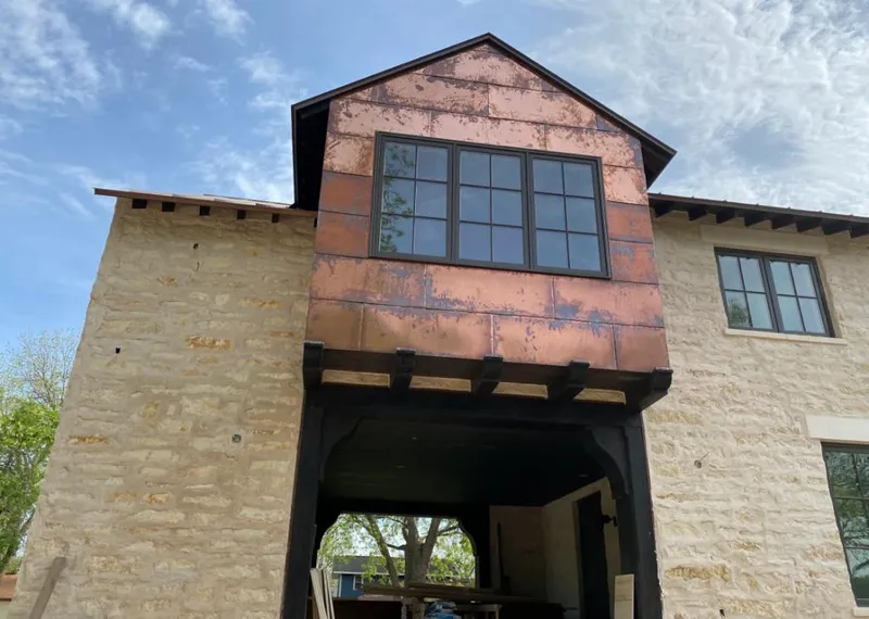 Copper metal panel facade on a stone building for Skylight Installation in Clarks Summit